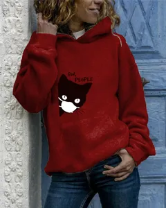 Detail shot of the wine red hooded sweatshirt featuring a cute cat graphic and long sleeves.