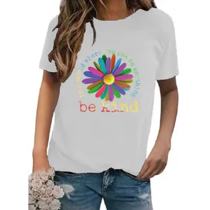 Detail view of the colorful daisy graphic and inspirational text printed on t-shirt.