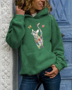 Green long sleeve hoodie detail with artistic cat graphic print and cozy hood for women style.