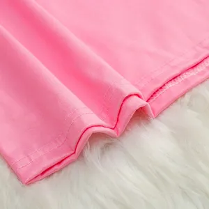 Detailed view of pink women's tank top showing fine stitching and soft fabric texture.