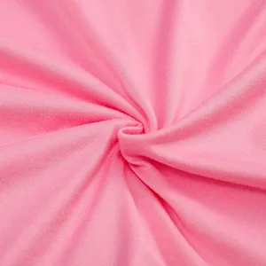 Detailed view of soft pink fabric texture showcasing the fine knit material quality.