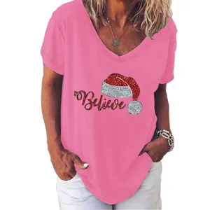 Close-up detail of the pink V-neck short sleeve t-shirt featuring a glitter Christmas hat graphic.