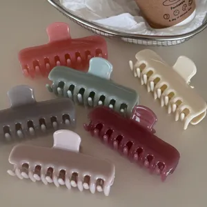 Jelly color hair claw clip detail shot, showing multiple stylish acrylic hair accessories.