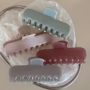 Detailed close-up of pastel jelly hair claw clips in four lovely colors for daily styling.