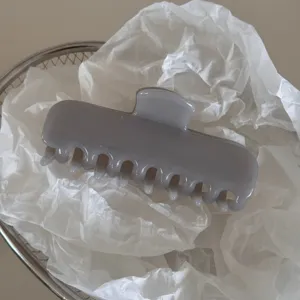 Grey jelly hair claw clip medium size elegant hair accessory for women styling daily wear detail view