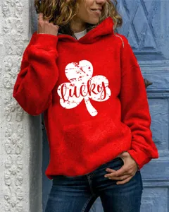 Red hooded sweatshirt featuring a distressed white four-leaf clover lucky graphic design.
