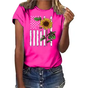 Close up of bright pink women t-shirt featuring American flag and sunflower print.