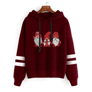 Close-up view of the Christmas gnome graphic and sleeve stripes detail on the burgundy hoodie.