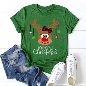 Detailed view of Christmas reindeer print green t-shirt with rolled sleeves and festive vibe.