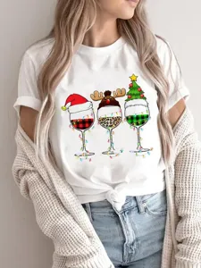Christmas wine glasses graphic detail on white short sleeve t-shirt, casual holiday wear.