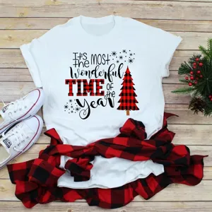 Christmas tree graphic short sleeve white t-shirt flat lay with holiday styling decor detail