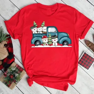 Detailed close-up shot of red short sleeve T-shirt with cute Christmas truck snowman graphic.