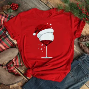 Christmas wine glass graphic detail view, festive red short sleeve t-shirt design style.