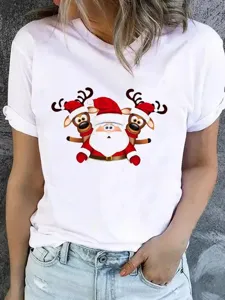 Closeup detail of Christmas graphic T-shirt featuring cute Santa and reindeer cartoon print.