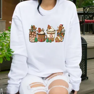 Detailed view of Christmas gingerbread print on this white casual crewneck long sleeve sweatshirt.