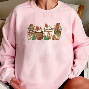 Pink Christmas gingerbread sweatshirt detail, festive holiday graphic top, cozy winter apparel.