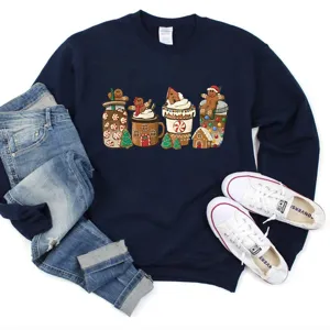 Detail view of Christmas gingerbread graphic sweatshirt styled with denim jeans and sneakers.