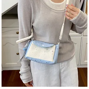 Detailed view of the cute star pattern crossbody bag, trendy small shoulder and phone bag.