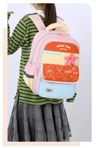Kids school backpack detail view, featuring vibrant color blocks and cute plush starfish.