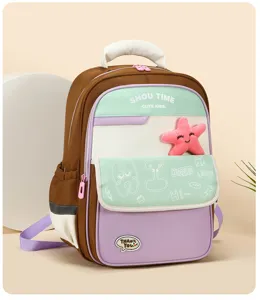 Kids colorblock school backpack with star plush pendant, casual book bag for boys and girls.