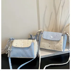 Detailed view of the cute star print crossbody bag, stylish small shoulder bag for women.