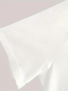 White short sleeve t-shirt fabric and cuff detail view showing soft texture and fine stitching.