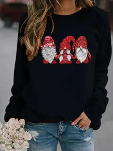 Close-up detail of the Christmas gnome graphic print on this cozy black fleece sweatshirt sleeve.