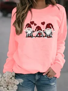 Close-up detail of women pink long sleeve sweatshirt with cute gnomes graphic print casual top.