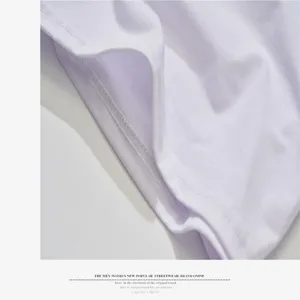 Close-up detail of white short-sleeve t-shirt fabric, clean stitching and soft texture.