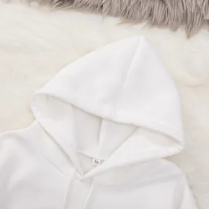 Close-up detail view of white solid color hoodie hood with adjustable drawstring and inner size tag.