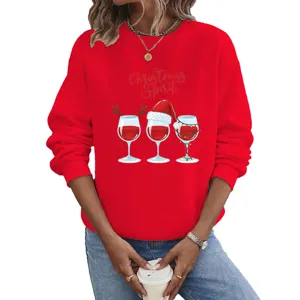 Close-up detail of the red long-sleeve crewneck sweatshirt featuring Christmas wine glass graphic.