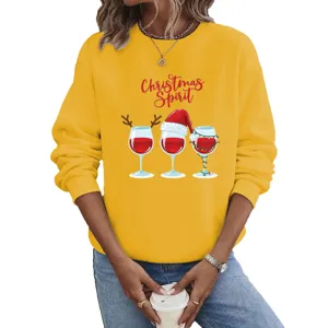 Detailed view of women's yellow Christmas wine print long sleeve sweatshirt top.