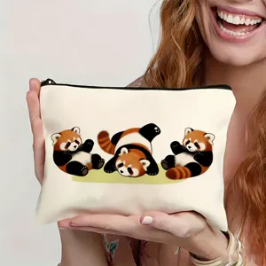 Close-up detail of a white canvas zipper pouch featuring cute red panda cartoon prints.