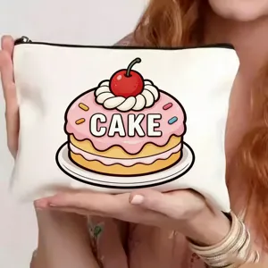 Detailopname van het witte canvas cosmetisch tasje met leuk schattig taart printontwerp.