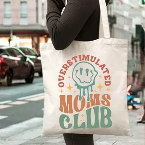 Detailed shot of canvas tote bag with graphic print, casual shoulder bag style for daily commuting.