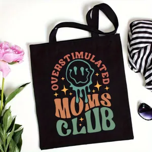 Black canvas tote bag detail featuring retro graphic print and lifestyle scene props.