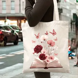 Borsa tote in tela con libro vintage e stampa di fiori, dettaglio di borsa a spalla casual.