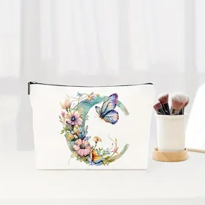 Canvas cosmetic makeup bag with elegant watercolor floral butterfly letter C design for women.
