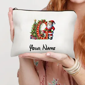 Personalisierte Weihnachtsmann Kosmetiktasche mit Buchstaben G und festlichem Motiv.