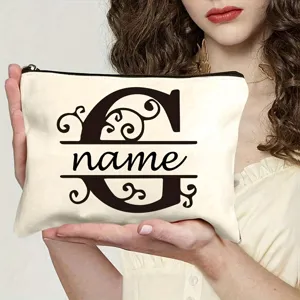Trousse de maquillage en toile avec lettre personnalisée et design monogramme élégant.