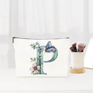 Watercolor letter P floral makeup bag detail showing elegant butterfly and floral monogram print.