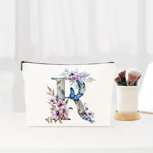 Floral letter R canvas cosmetic bag, elegant storage pouch for daily makeup and travel essentials.