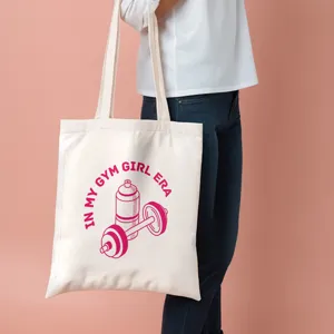 Vue détaillée du sac cabas en toile montrant l'impression graphique de fitness élégante.