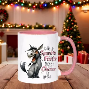 Ceramic coffee mug with funny donkey print and pink handle, perfect Christmas gift for friends.