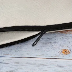 Close-up detail of canvas cosmetic bag zipper, premium beige fabric and black zip closure.