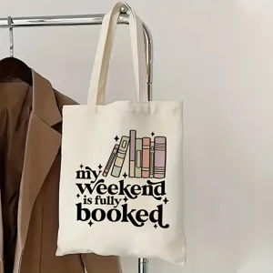 Sac cabas en toile avec imprimé de livres et slogan, idéal pour l'école et le quotidien.