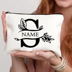 Gepersonaliseerde canvas cosmetische tas met letter S en naam, stijlvolle make-up pouch.