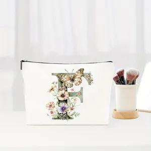 Watercolour letter F floral makeup bag detail, elegant cosmetic pouch for daily use or travel.