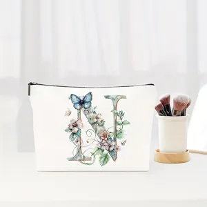 Canvas cosmetic bag with elegant watercolor letter N and floral butterfly print for gifts.