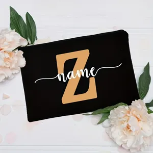 Customizable black canvas cosmetic bag with letter Z and forest floral background detail view.